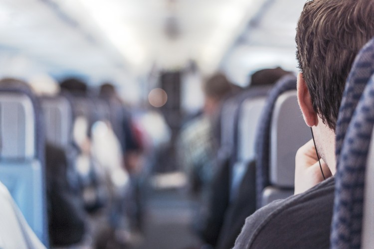 Airline passenger looks down the aisle