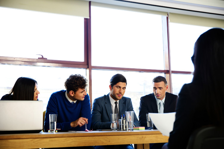 Interview panel listens to candidate's answer