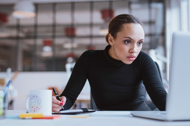 Job seeker researching on computer