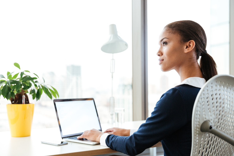 Job seeker researches employers on computer